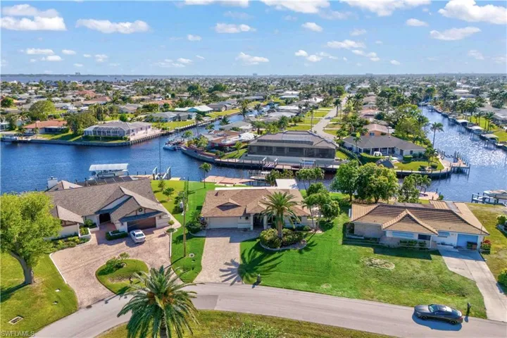 An aerial view of the front of the home offers a stunning perspective of the property’s layout and surroundings.