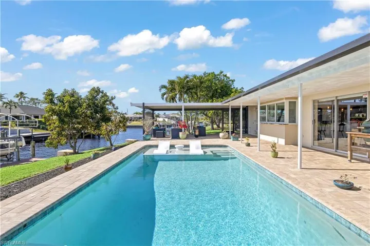 The deep blue water of the pool invites a refreshing dip, while a cozy lounge area set the scene for a peaceful escape.