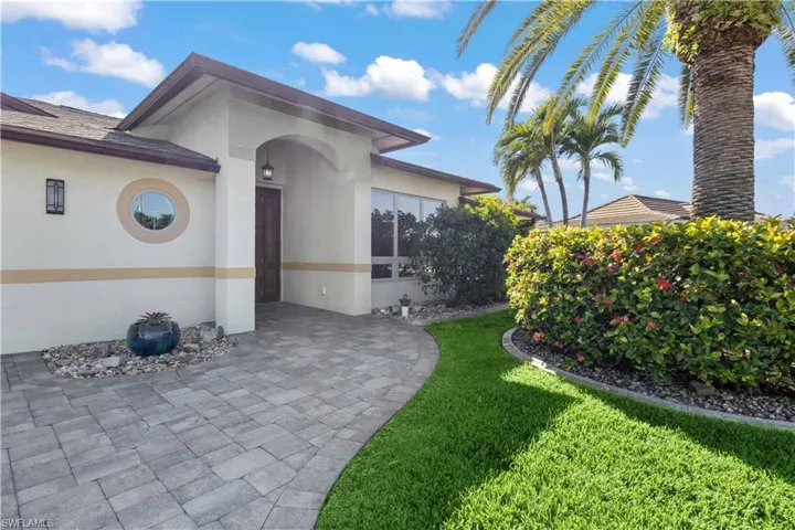 Whether it's a sunny day or evening, the front of the home serves as a warm, welcoming introduction to the space within.