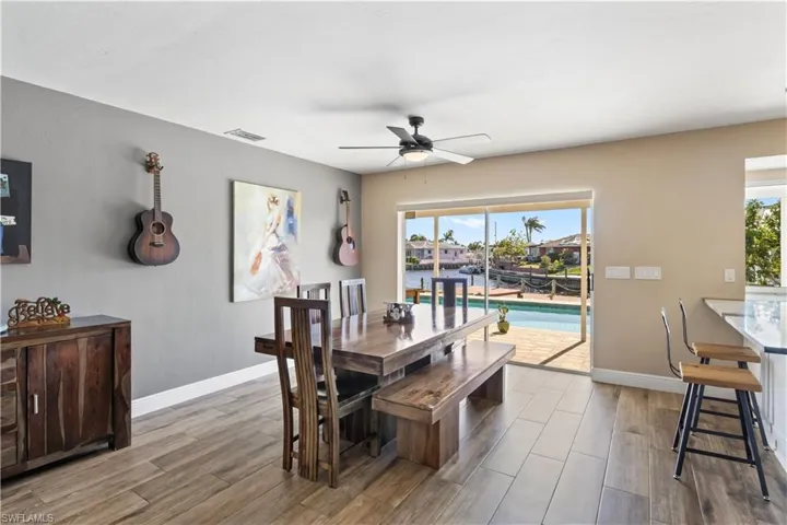 The dining area, just off the kitchen, is a perfect spot for enjoying meals while taking in the stunning views.