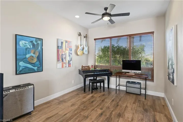 The formal dining room, traditionally reserved for special occasions, has been thoughtfully transformed into a cozy den, offering a more relaxed and functional space.
