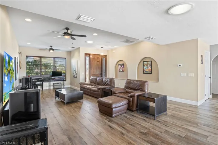 Spacious and inviting living area with an open layout, abundant natural light, and seamless flow to dining and outdoor spaces—perfect for relaxing or entertaining in style!