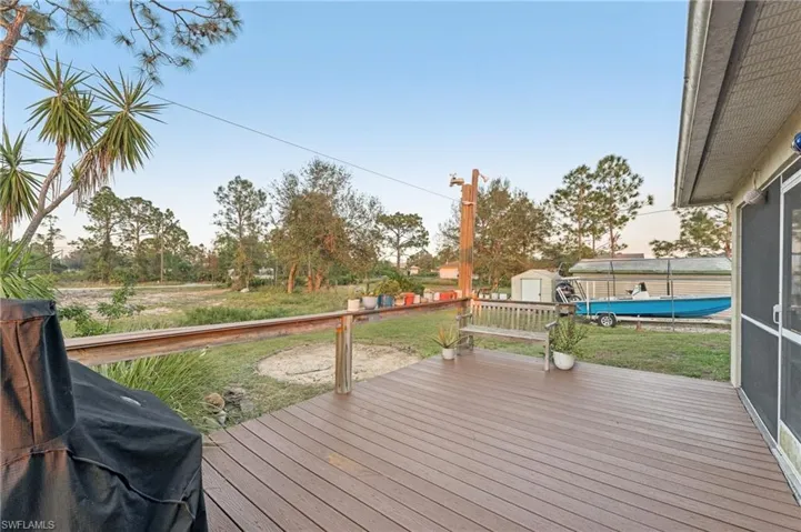 Deck at dusk with a grill