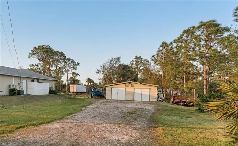 Garage with a yard and central AC