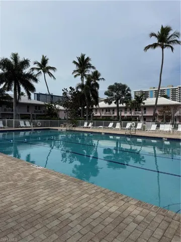 Community pool featuring a patio