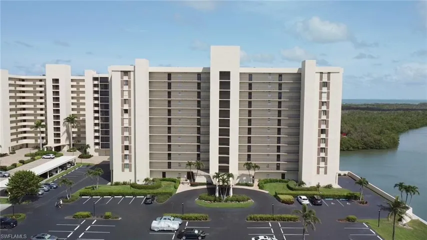 View of apartment building / complex with a water view