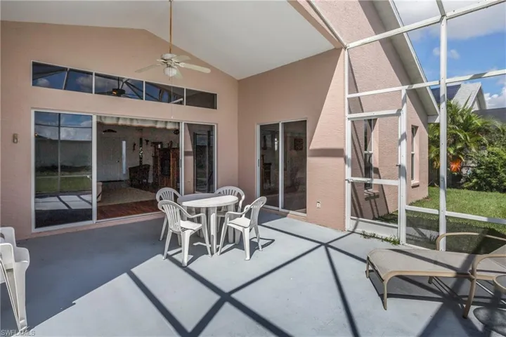 Sunroom featuring lofted ceiling and ceiling fan