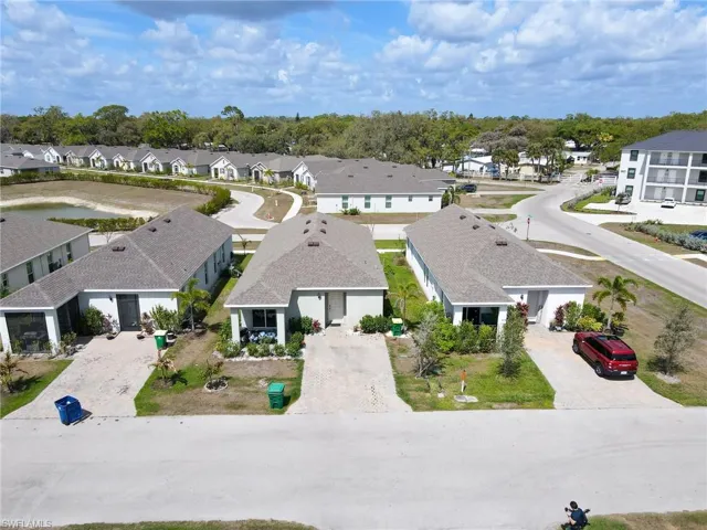 Aerial view of residential area featuring a tree filled landscape