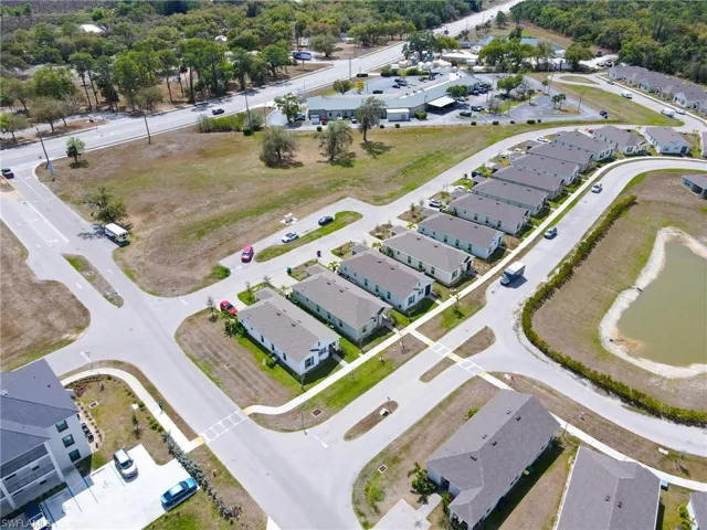 Aerial view of property's location featuring nearby suburban area