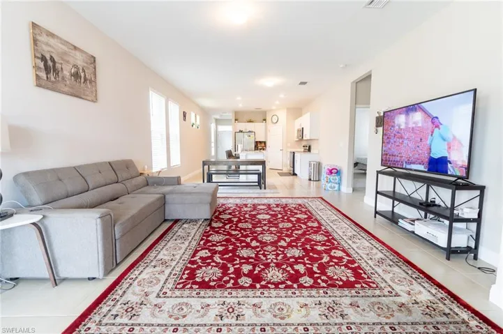 Living room featuring light tile patterned flooring