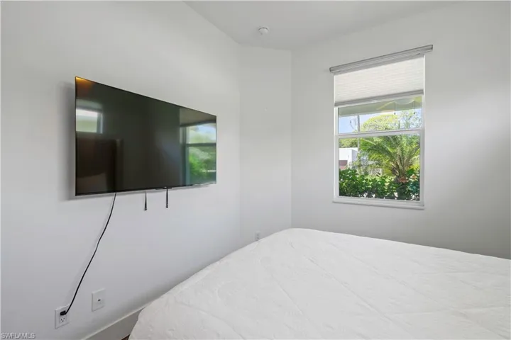 Bedroom featuring multiple windows
