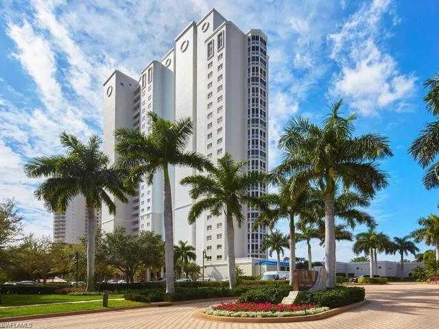 Stunning view of Esperia South, surrounded by lush landscaping that enhances the building's curb appeal.