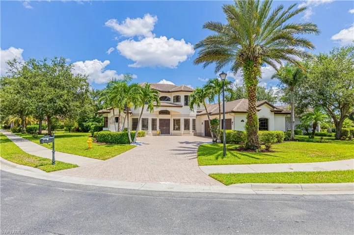 Mediterranean / spanish-style house featuring a front yard