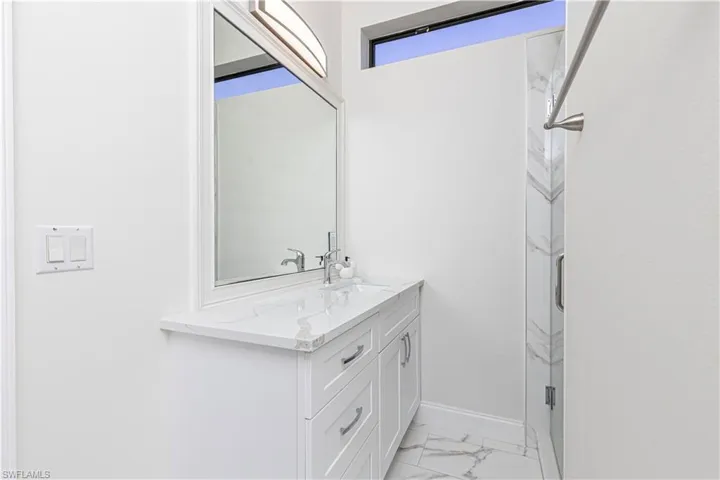 Bathroom featuring tile patterned floors and vanity