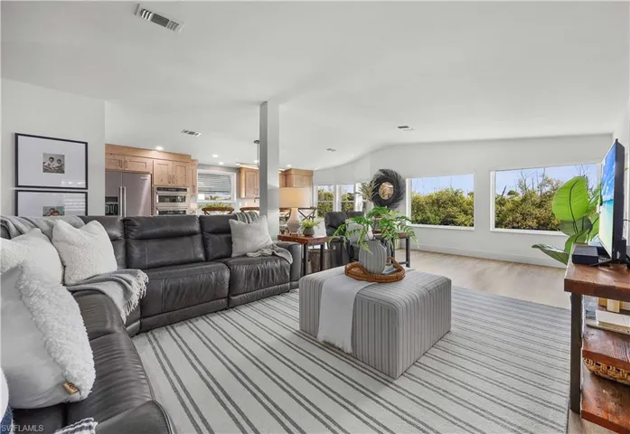 Spacious great room with expansive canal views