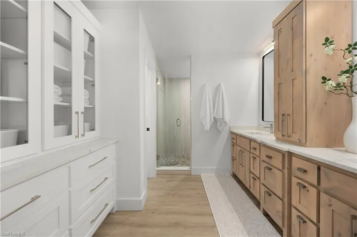 Built-in storage cabinetry w/ glass fronts