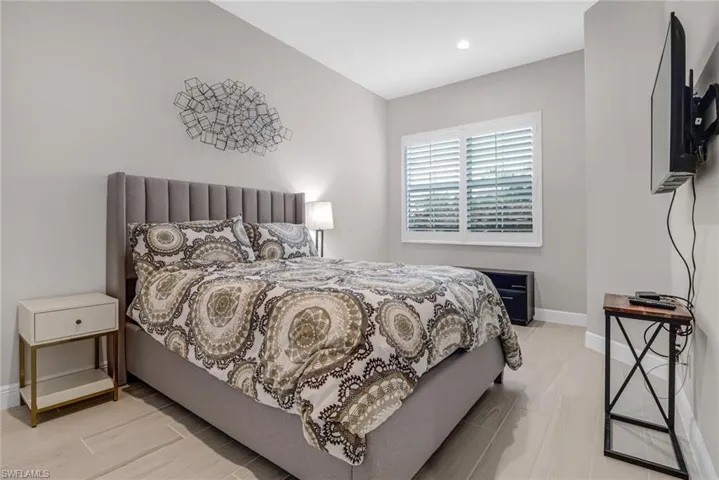 Bedroom featuring recessed lighting and baseboards