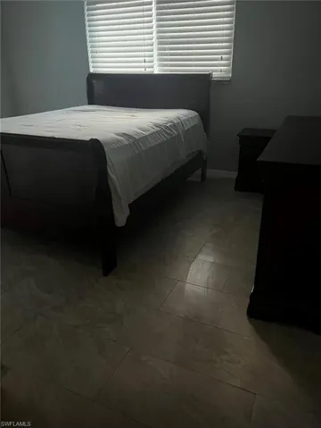 Bedroom with baseboards