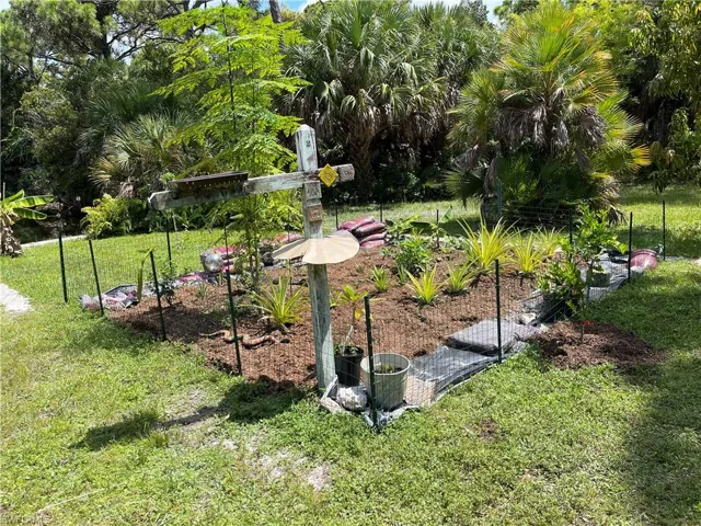 View of yard featuring a garden.