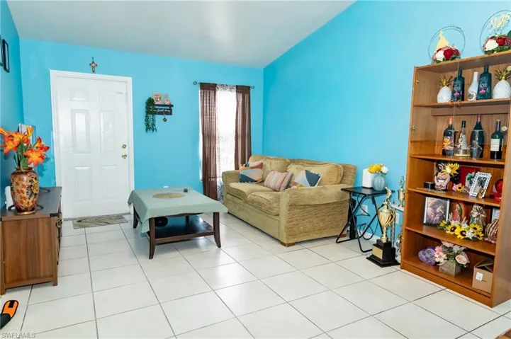 Unit 1033 Living room featuring light tile patterned flooring