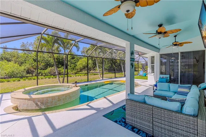 View of patio / terrace with an outdoor hangout area, a sunroom, ceiling fan, and a pool with connected hot tub