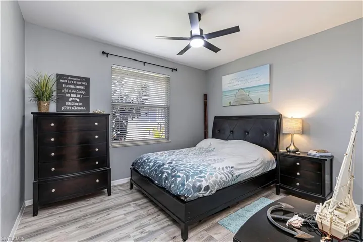 Bedroom featuring light wood-type flooring and a ceiling fan