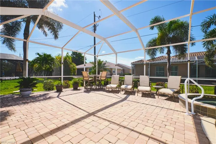 View of patio featuring a lanai and a sunroom
