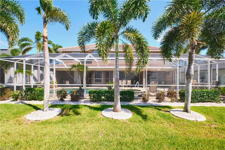 View of property with an outdoor pool
