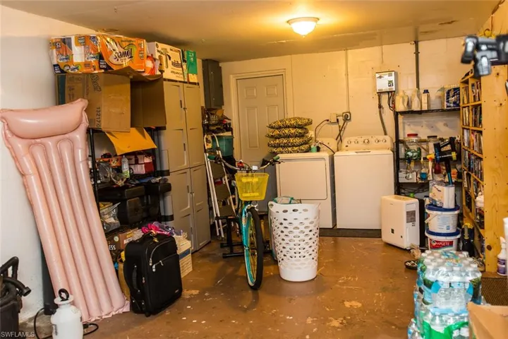 Storage room with washing machine and clothes dryer