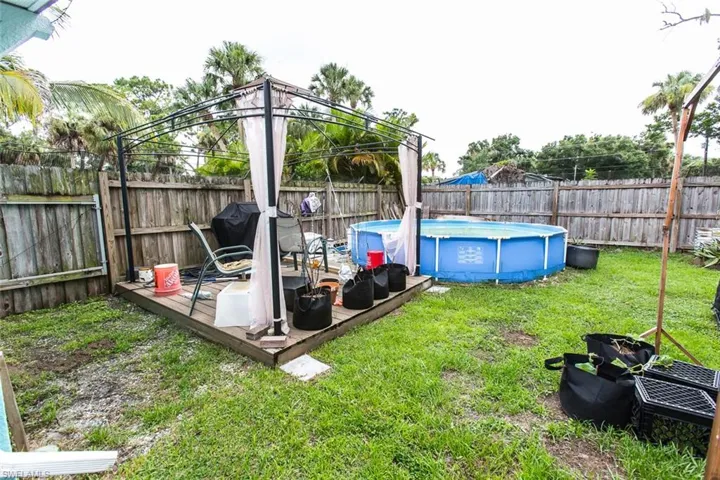 View of yard with a gazebo and a fenced in pool