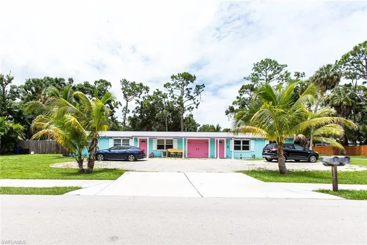 Single story home with a front lawn