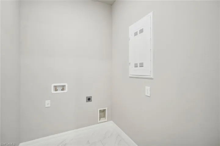 Washroom featuring hookup for a washing machine and electric dryer hookup
