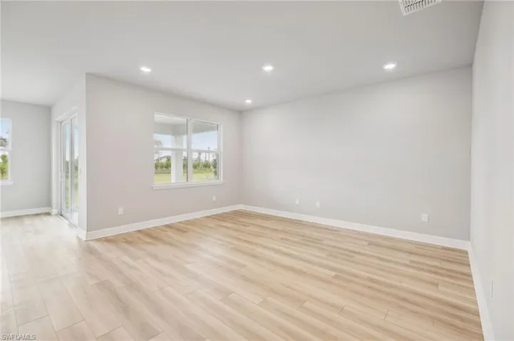 Spare room with light hardwood / wood-style flooring