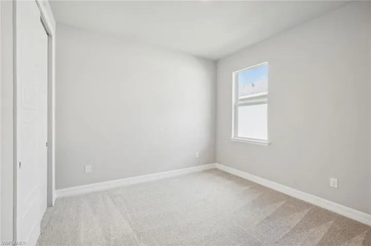 Unfurnished bedroom featuring carpet