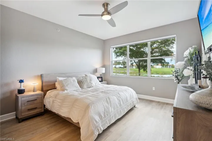 Bedroom featuring ceiling fan and light hardwood / wood-style flooring