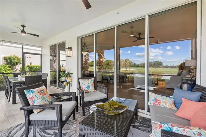 Sunroom / solarium with a water view