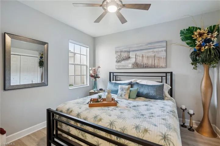 Bedroom featuring ceiling fan and wood-type flooring
