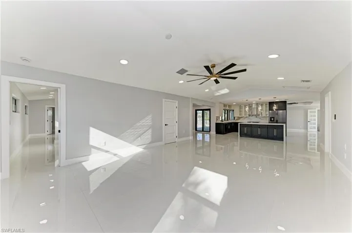 Unfurnished living room with recessed lighting and ceiling fan