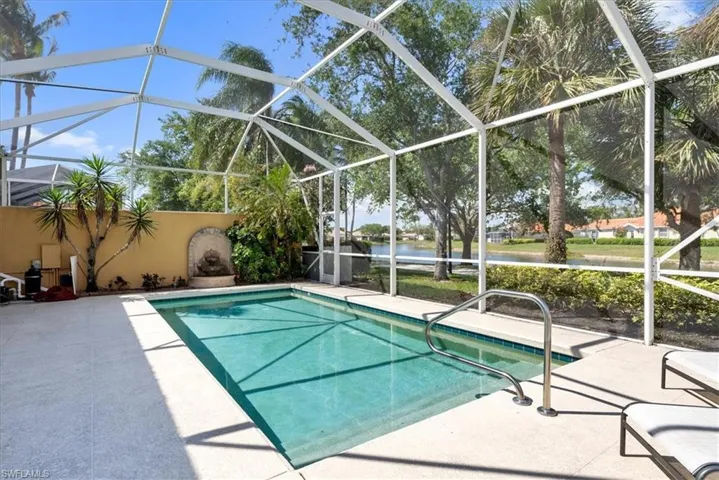 Pool with a lanai and a patio area
