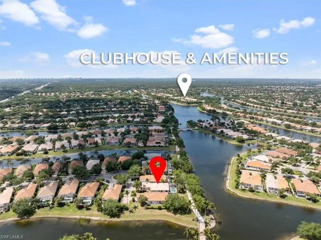 Aerial view featuring a water view and a residential view