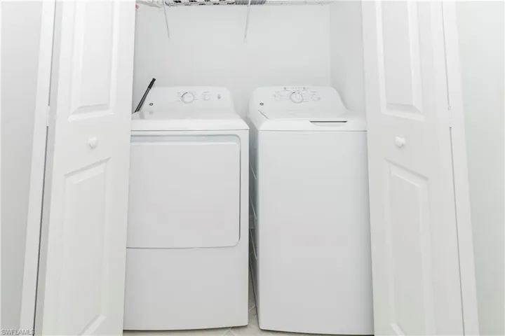 Laundry area featuring independent washer and dryer