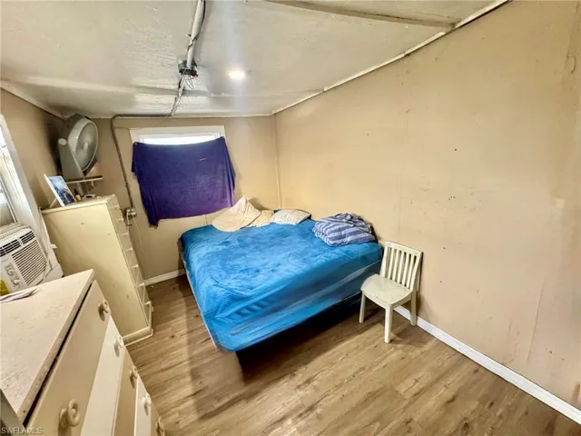 Bedroom featuring baseboards and light wood-style flooring