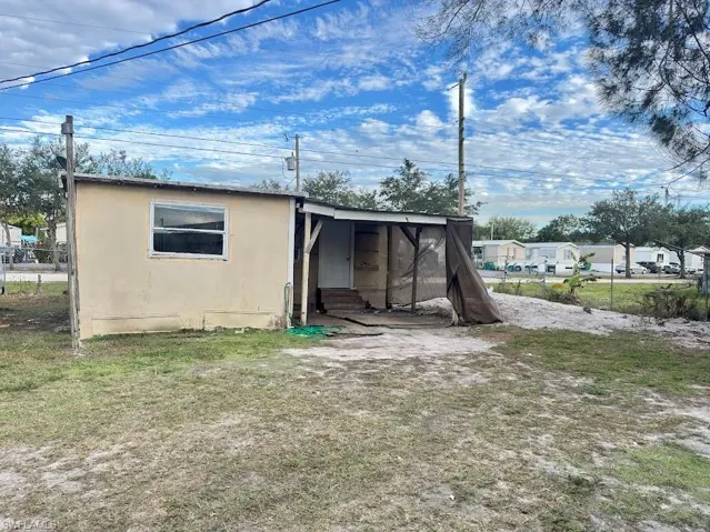 Back of property with entry steps