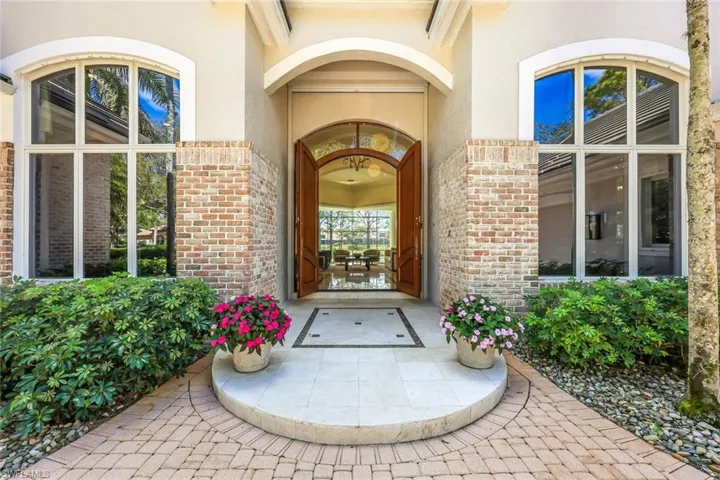 Marble Entry w/ Imposing Custom Wood Door