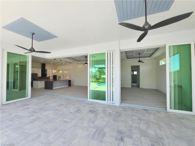 10' High pocketing sliding impact glass doors towards great room and master bedroom