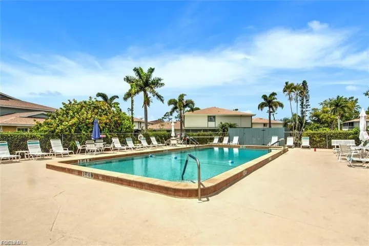 Community pool with a patio area
