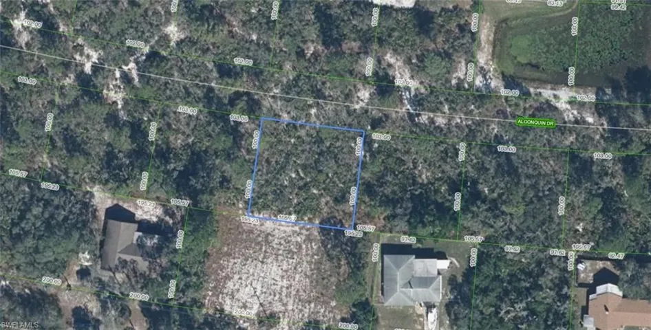 Aerial Survey. Displaying the property's boundaries and surrounding parcels, with an identified street name