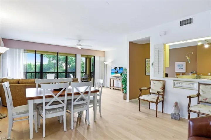 Dining space featuring light wood finished floors and a ceiling fan