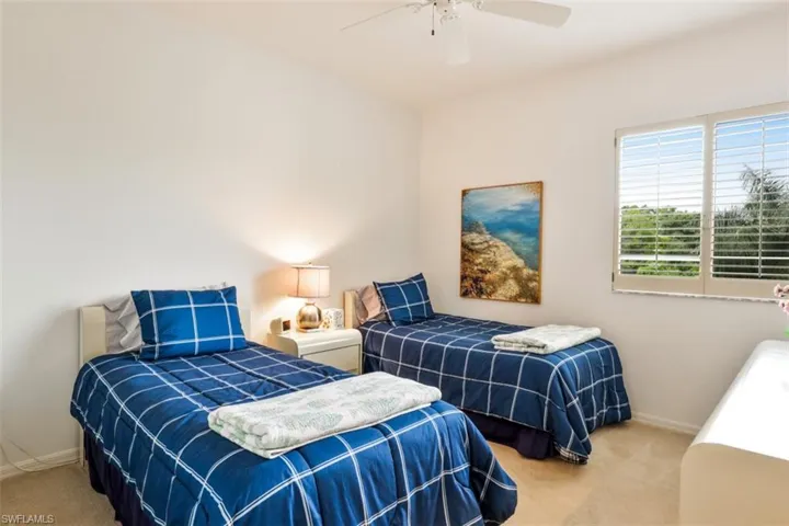 Bedroom featuring carpet flooring and a ceiling fan