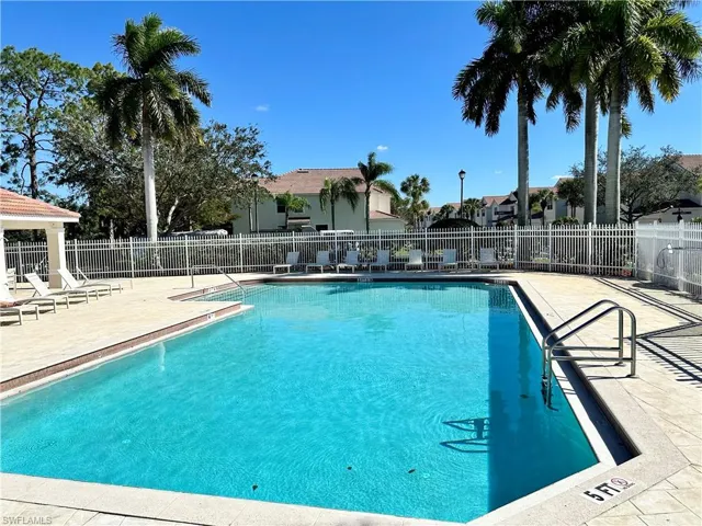 Community pool featuring a patio area